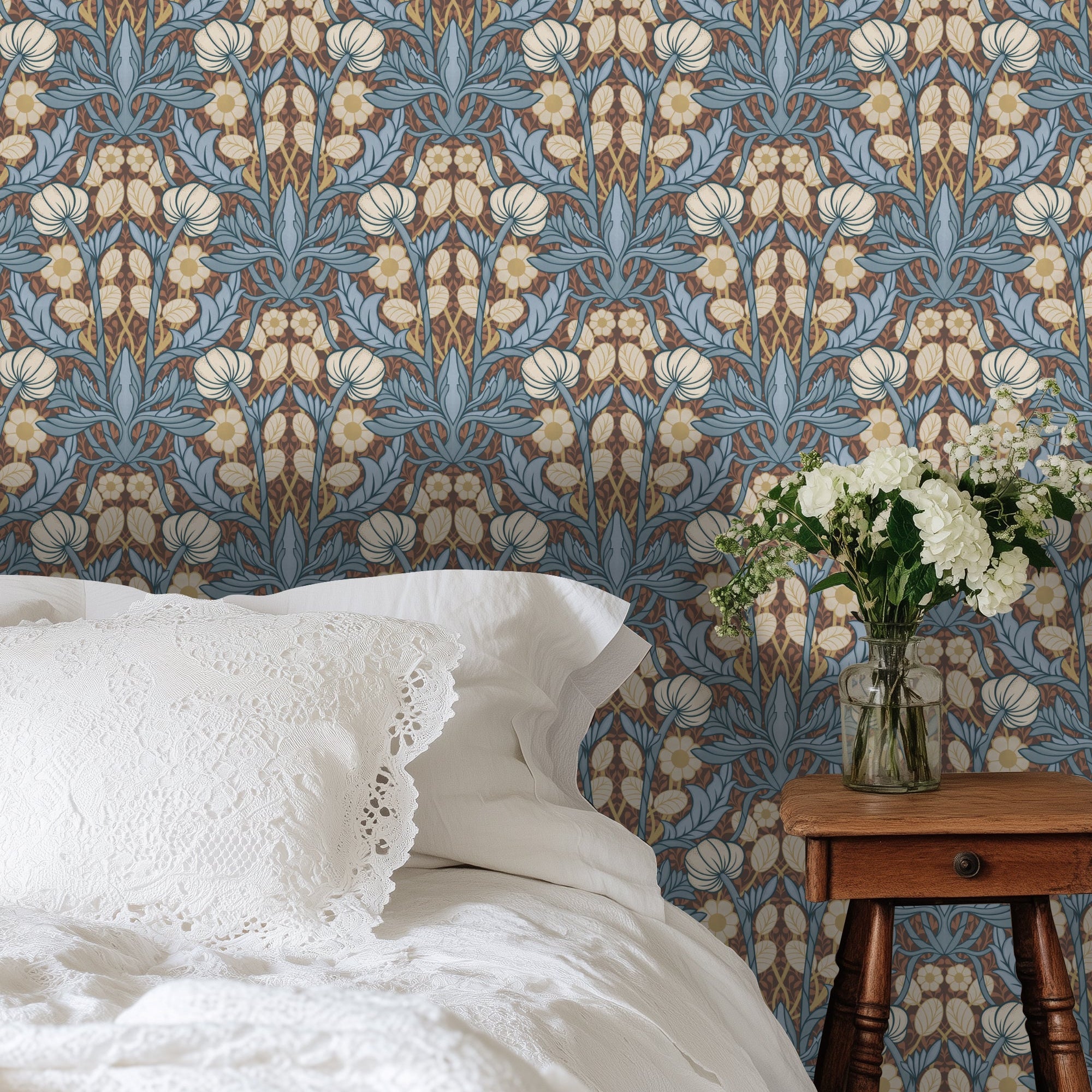 Bedroom with floral wallpaper, white bedding, and a wooden side table with flowers.