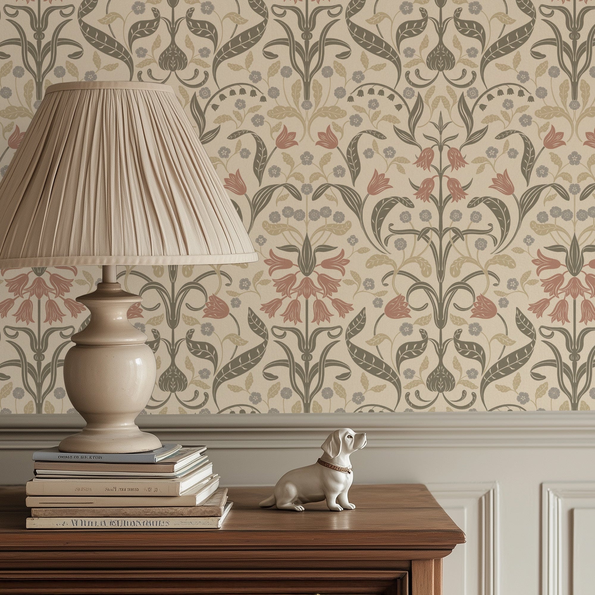 Decorative wallpaper with floral pattern, lamp, books, and small dog statue on a wooden console.